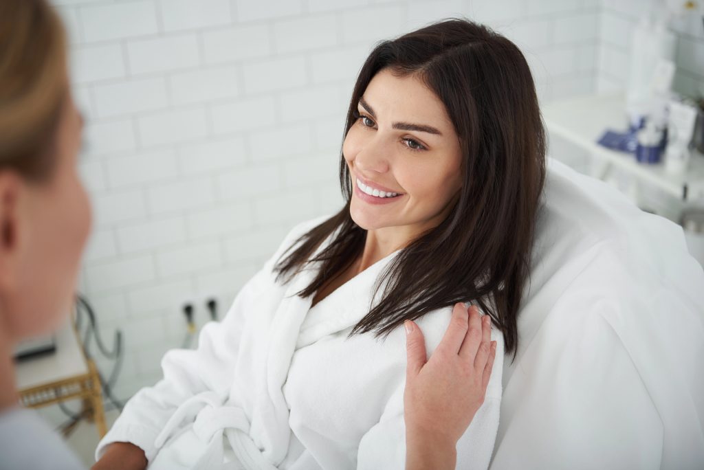 Woman at cosmetic treatment consultation