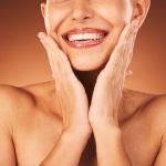 Woman with defined jaw and smile after Botox